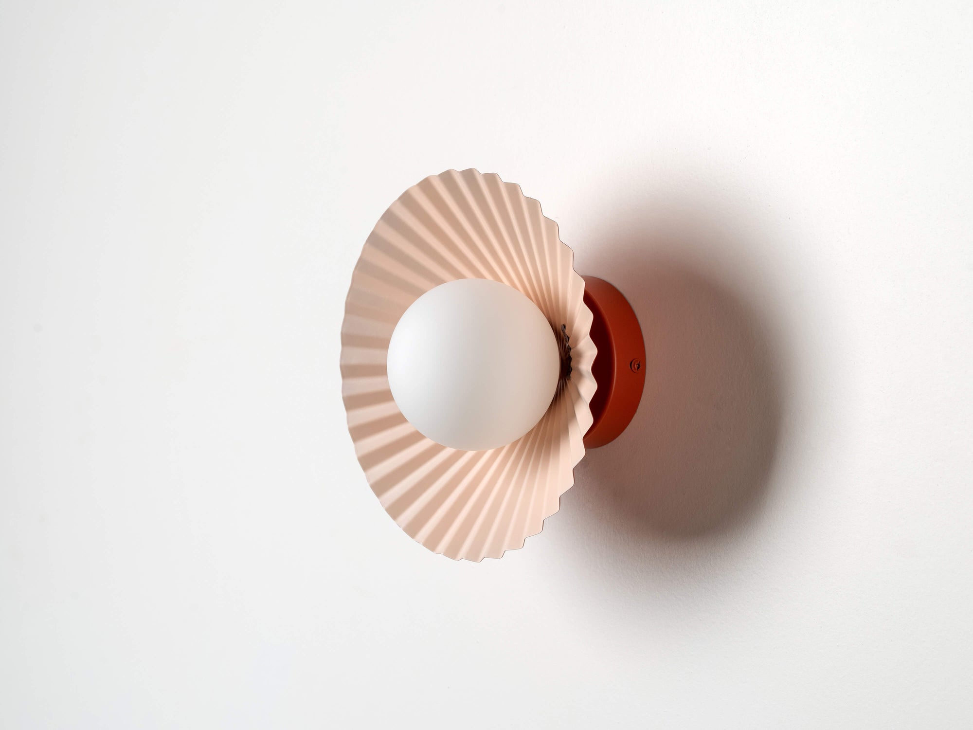 Burnt orange flush pleat wall light