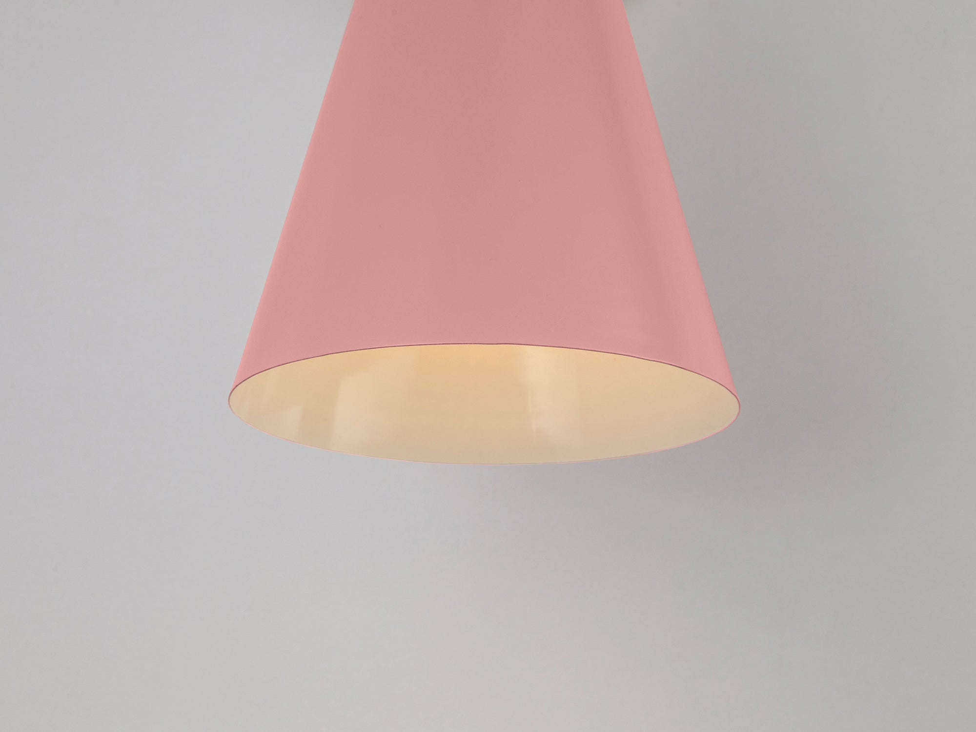 Pink cone shade wall light